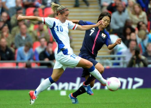 Japan's forward Kozue Ando (R) vies for the ball with France's Camille Abilly during their women's football semifinal match between Japan and France at the Wembley Stadium in London, during the London 2012 Olympic Games. Japan edged closer to their dream of a rare footballing double Monday after holding off a late onslaught from France to reach the final