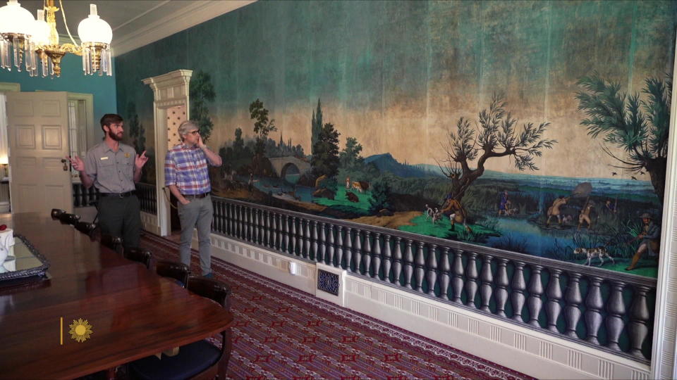 Ranger Zach Anderson with correspondent Mo Rocca at Lindenwald, where this wallpaper has hung for more than 180 years. / Credit: CBS News