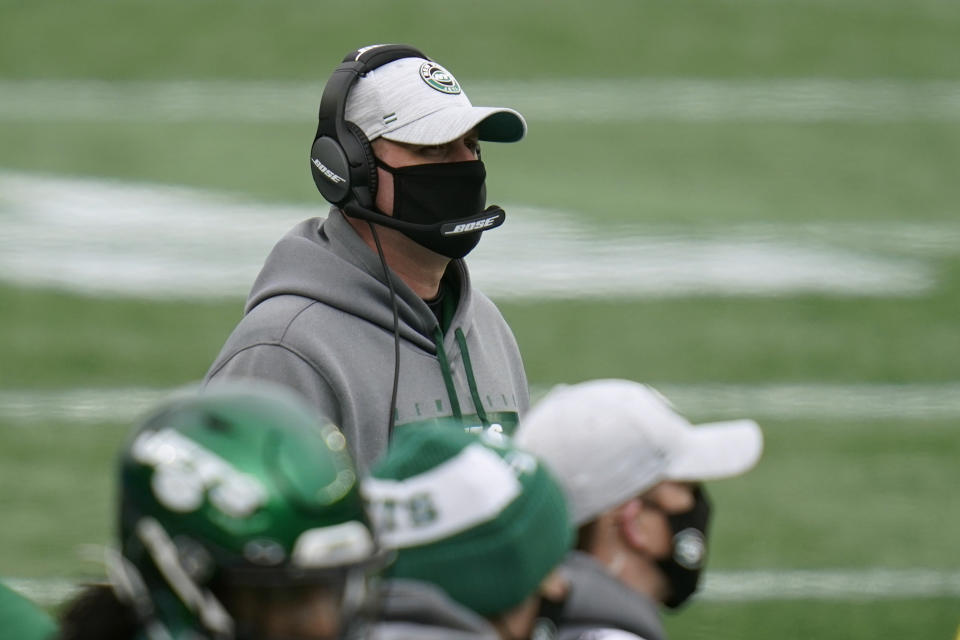 New York Jets head coach Adam Gase watches from the sideline in the first half of an NFL football game against the New England Patriots, Sunday, Jan. 3, 2021, in Foxborough, Mass. (AP Photo/Charles Krupa)