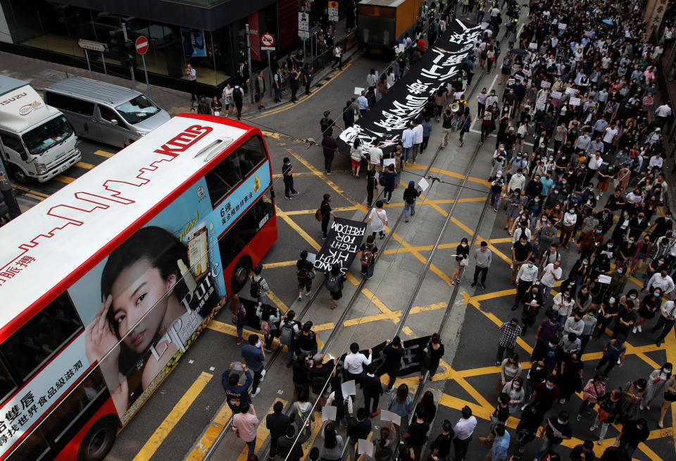 People attend a rally after the news broke that Chow Tsz-lok, 22, a university student who fell during protests at the weekend, died early on Friday morning, in Hong Kong, China November 8, 2019. REUTERS/Ahmad Masood