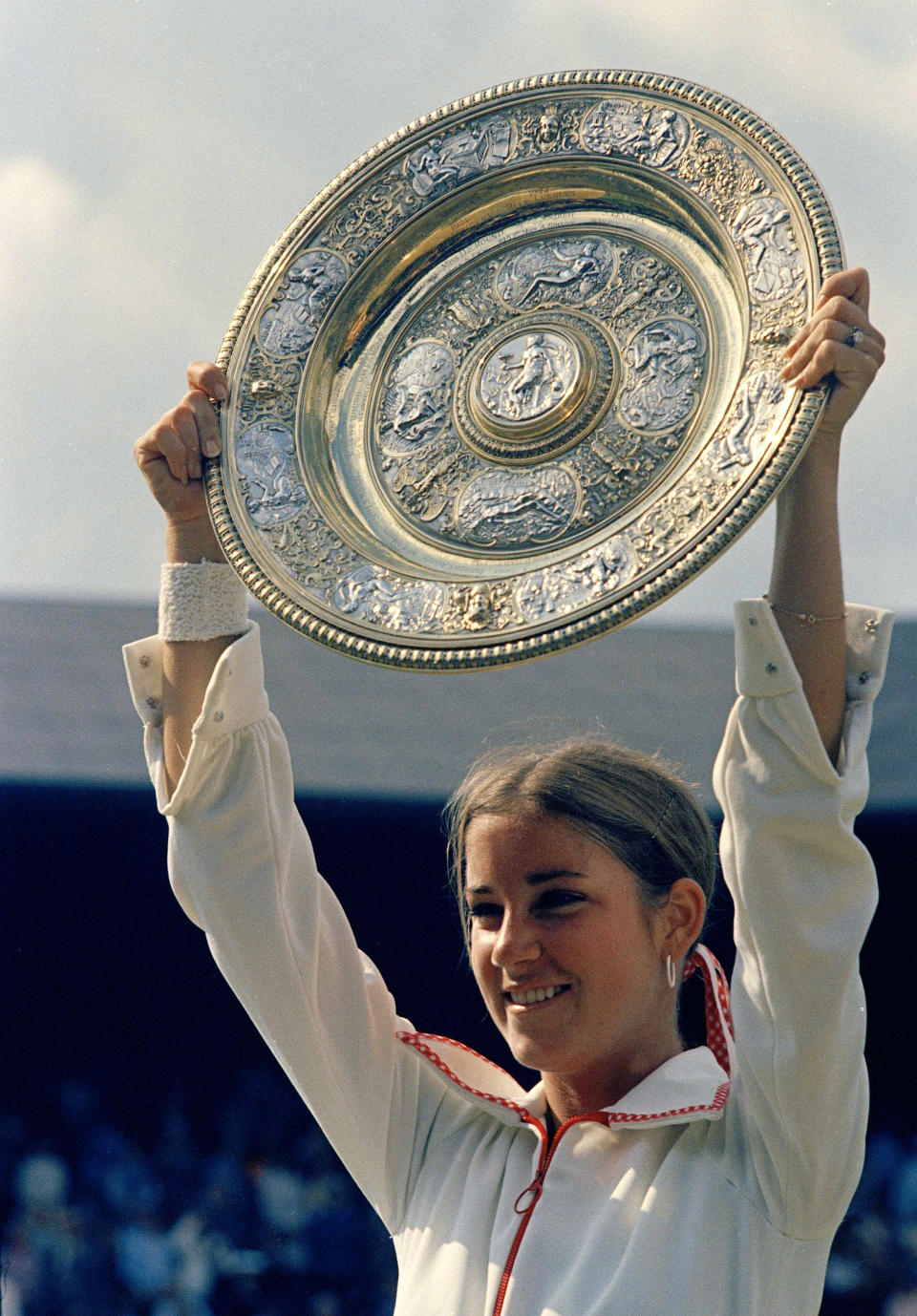 FILE - Chris Evert holds up her trophy after winning the Women's singles title at the Wimbledon tennis championships in London on July 7, 1974. (AP Photo, File)