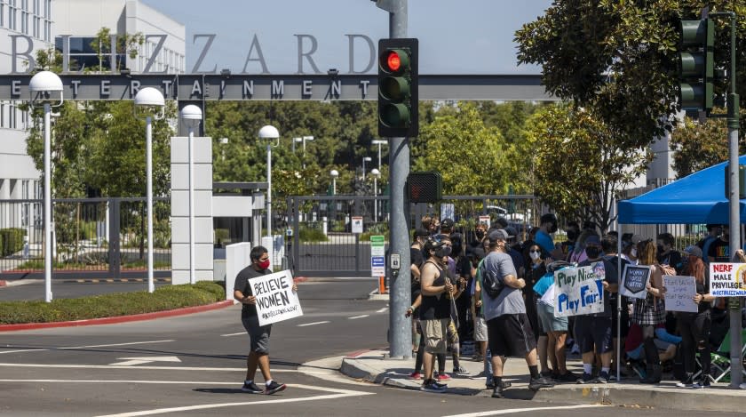 Irvine, CA - July 28: Several hundred Activision Blizzard employees stage a walkout which they say is in a response from company leadership to a lawsuit highlighting alleged harassment, inequality, and more within the company outside the gate at Activision Blizzard headquarters on Wednesday, July 28, 2021 in Irvine, CA. (Allen J. Schaben / Los Angeles Times)