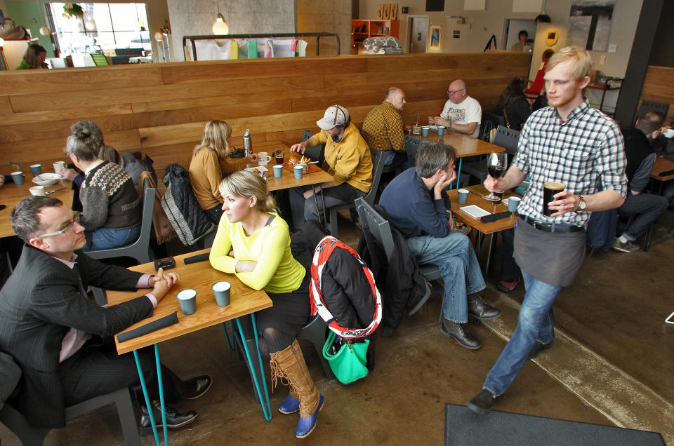 Restaurant review of Parka located on east Lake Street in Minneapolis. Waiter Jordan Hubred, right, brought drinks to patrons. (Photo: Marlin Levison/Star Tribune via Getty Images)