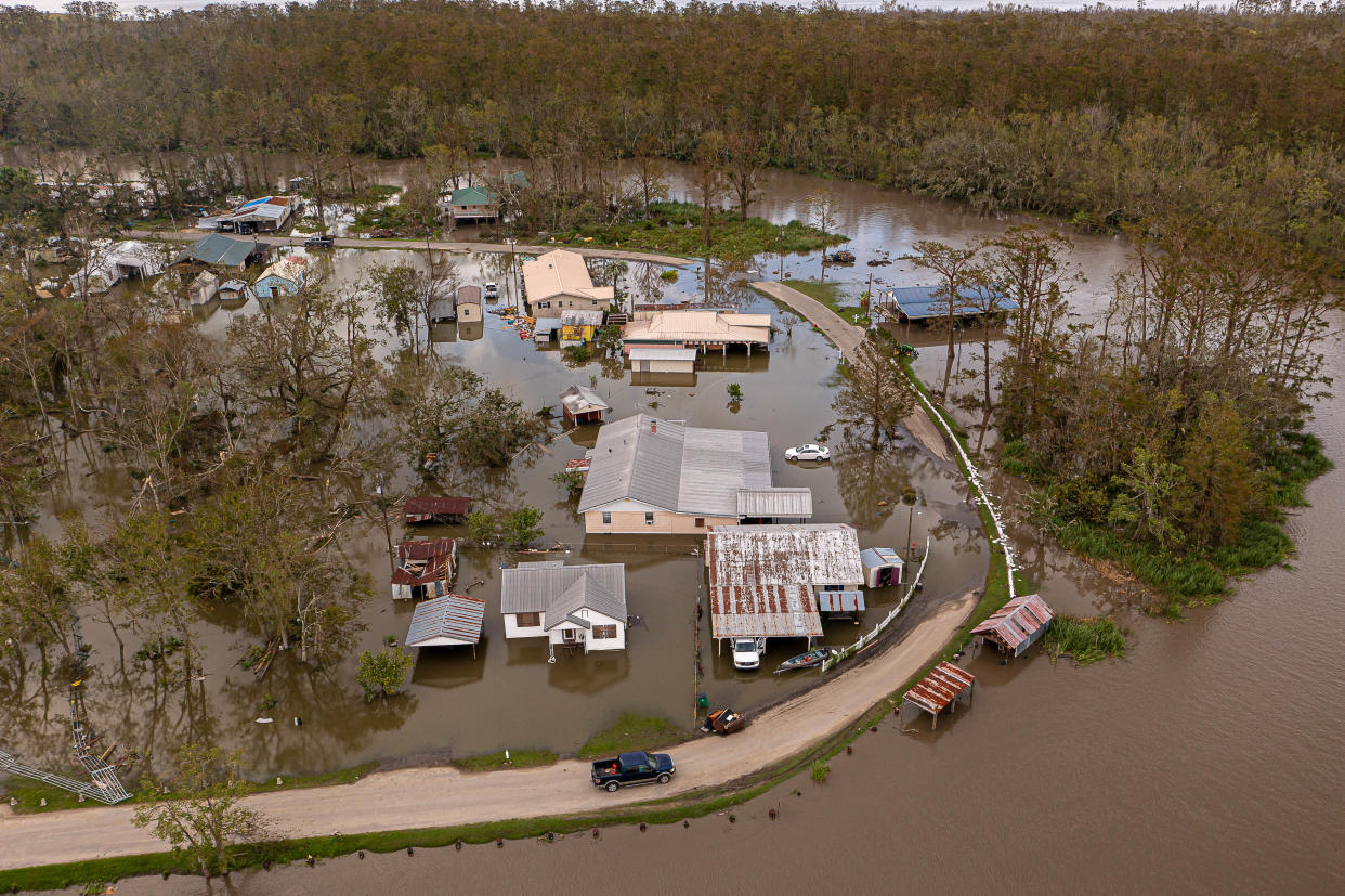 The small community of Kraemer, in northeast Lafourche Parish, La., remained flooded on Aug. 30, 2021, a day after Hurricane Ida sent several feet of water from Lake Des Allemands over the top of the area's 9-foot levee. [AARON E. MARTINEZ/AMERICAN-STATESMAN/FILE]