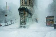 <p>New York City’s flatiron building is buffeted by a snowstorm. (Michele Palazzo) </p>