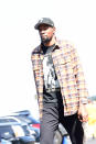 Kevin Durant wears a Pearl Jam "Choices" t-shirt underneath a brown flannel.