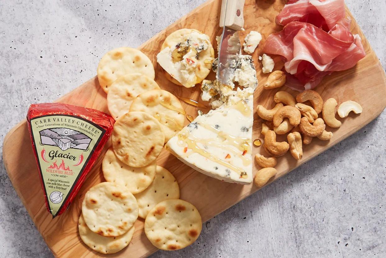 Spread showing Trader Joe's Carr Valley Cheese, crackers, nuts, and prosciutto