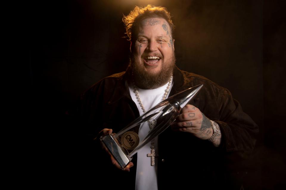 Jelly Roll stands backstage holding his CMA award at Bridgestone Arena in Nashville, Tenn., Wednesday, Nov. 8, 2023. Jelly Roll told the Tennessean, “There’s a tale of two Nashville, that’s happening with me right now. Nashville the music industry that has embraced me so lovingly but I represent equally the Nashville I grew up in as a local.”