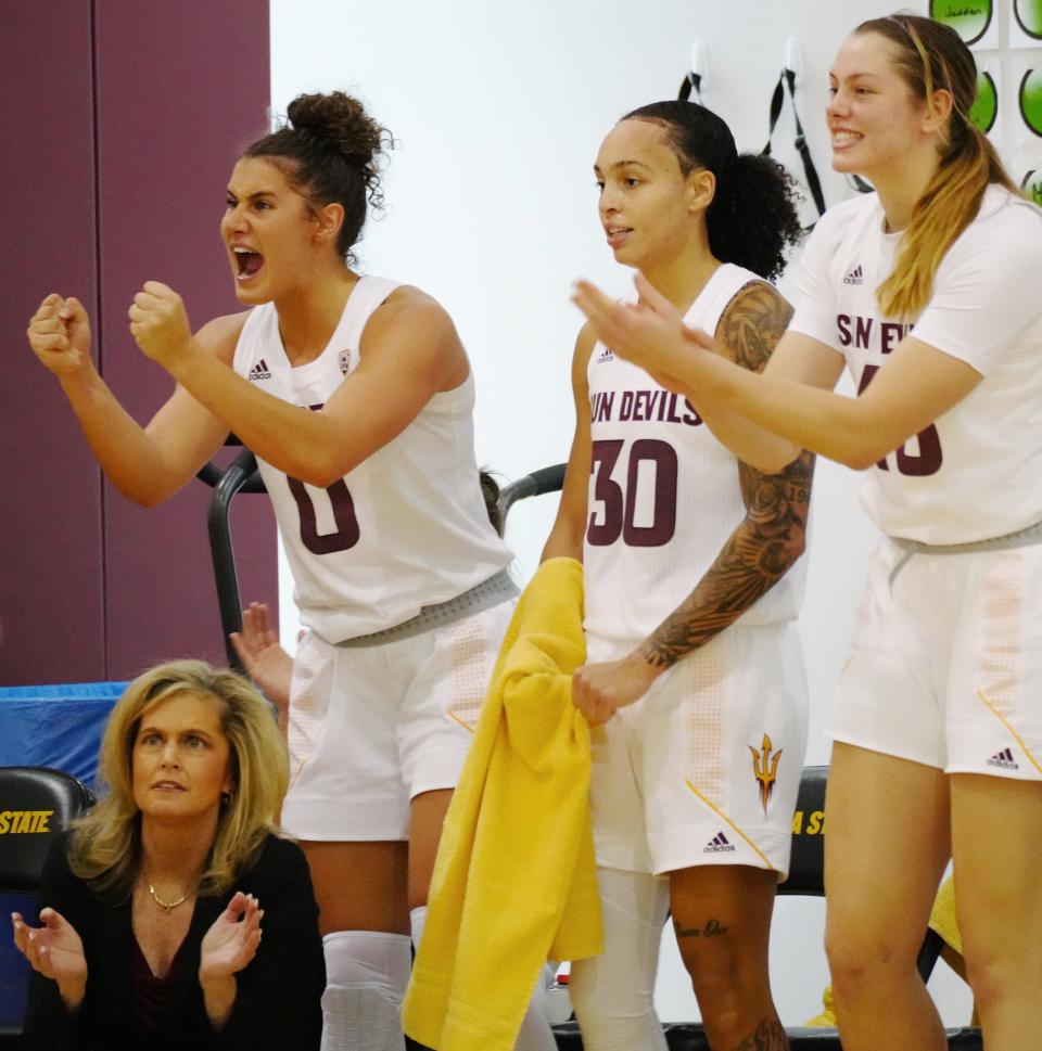 Dec 21, 2021; Tempe, AZ, United States; ASU's head coach Charli Turner Thorne (L-R), Taya Hanson, Jade Loville (30) and Imogen Greenslade (43) celebrate a basket against UC Irvine during a game at the Weatherup Center.