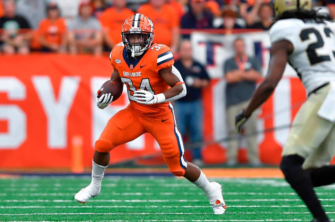 Syracuse running back Sean Tucker runs with the ball during the first half of an NCAA college football game against Purdue in Syracuse, N.Y., Saturday, Sept. 17, 2022.