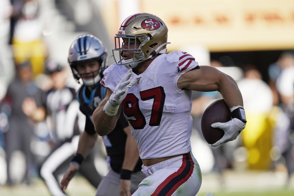 San Francisco 49ers defensive end Nick Bosa runs with the ball after making an interception during the second half of an NFL football game against the Carolina Panthers in Santa Clara, Calif., Sunday, Oct. 27, 2019. (AP Photo/Tony Avelar)