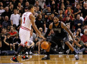 MIAMI, FL - JANUARY 29: Derrick Rose #1 of the Chicago Bulls is guarded by LeBron James #6 of the Miami Heat during a game at American Airlines Arena on January 29, 2012 in Miami, Florida. NOTE TO USER: User expressly acknowledges and agrees that, by downloading and/or using this Photograph, User is consenting to the terms and conditions of the Getty Images License Agreement. (Photo by Mike Ehrmann/Getty Images)