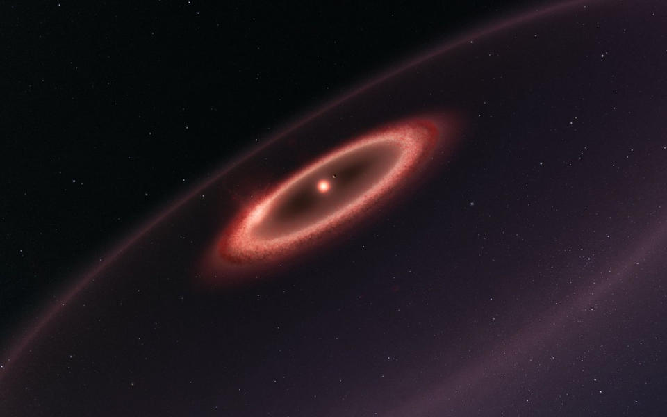 An artist's impression of the newly detected dusty belts around the sun's nearest neighbor, the red dwarf Proxima Centauri, and its potentially rocky world. <cite>ESO/M. Kornmesser</cite>
