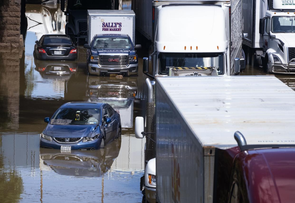 Cars and trucks are stranded by high water Thursday, Sept 2, 2021, on the Major Deegan Expressway in Bronx borough of New York as high water left behind by Hurricane Ida still stands on the highway hours later.