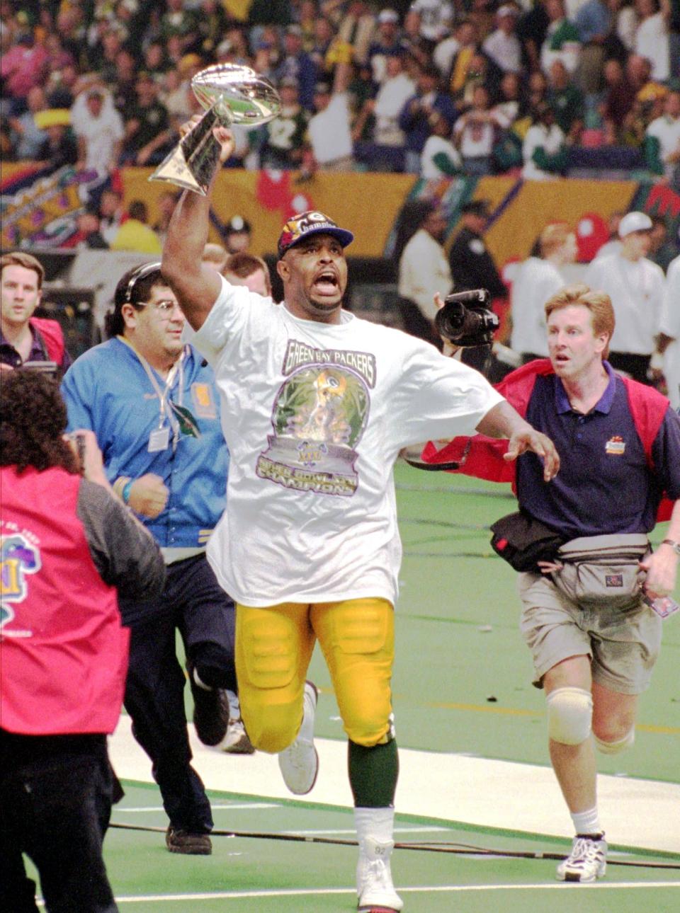 After winning Super Bowl XXXI, bringing the Lombardi Trophy back to Green Bay for the first time since 1967, Reggie White circled the Superdome in New Orleans with the prize. "It was the most fun I've ever had working," writes Patrick. "While watching 30 to 40 photographers chase Reggie around the field, I decided to wait in the end zone for him."