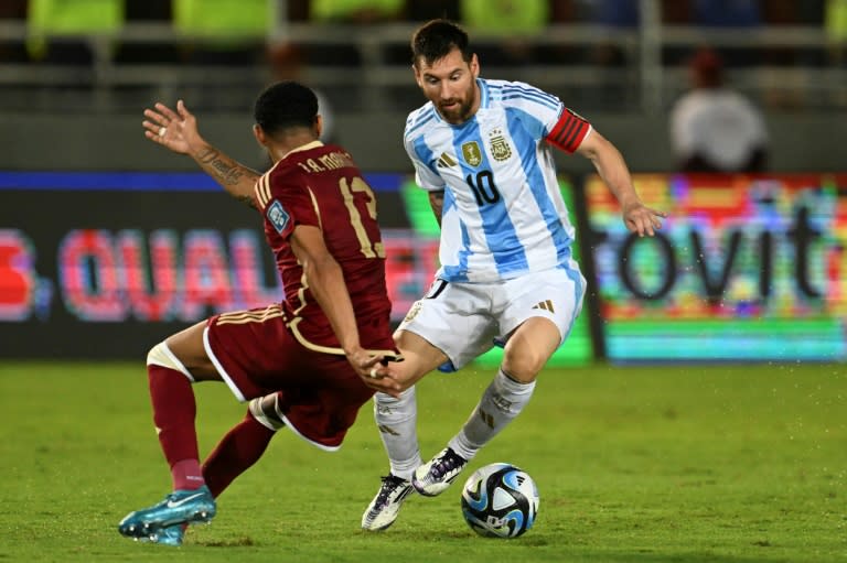 The return of Lionel Messi (right) couldn't inspire Argentina to victory in a 1-1 World Cup qualifying draw with Venezuela (JUAN BARRETO)