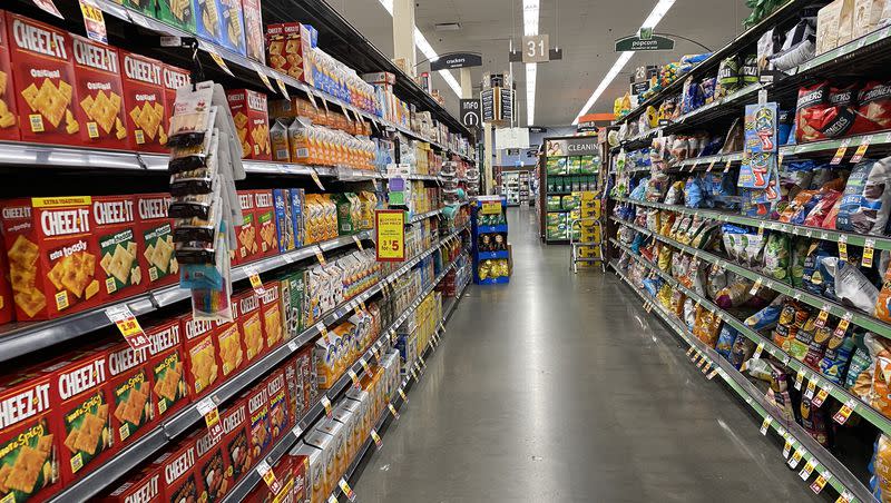 Boxes of crackers and bags of chips are pictured on the shelves of a local grocery store in Salt Lake City on April 11, 2022. A study shows ultra-processed foods may be as addictive as cigarettes.