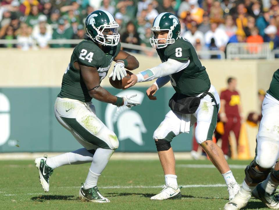Could Le'Veon Bell be following the free-agent path that Kirk Cousins, his former collegiate teammate at Michigan State, set last offseason? (Getty Images) 