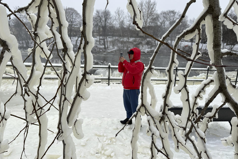 Mist from the Great Falls has created a frozen wonderland around the waterfalls in Paterson, N.J., on Thursday, Jan. 18, 2024. After several days of rain and snow, the falls are a torrential cascade of water. Frigid temperatures are blasting much of the U.S. and will continue to do so throughout the weekend. (AP Photo/Ted Shaffrey)