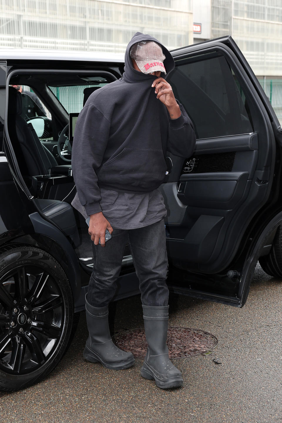 Kanye West wearing all black.