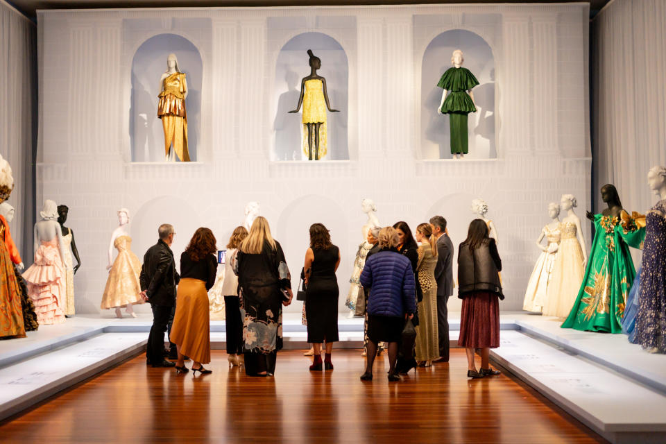 Guests enjoy the artisan fashion exhibit at the de Young Museum.