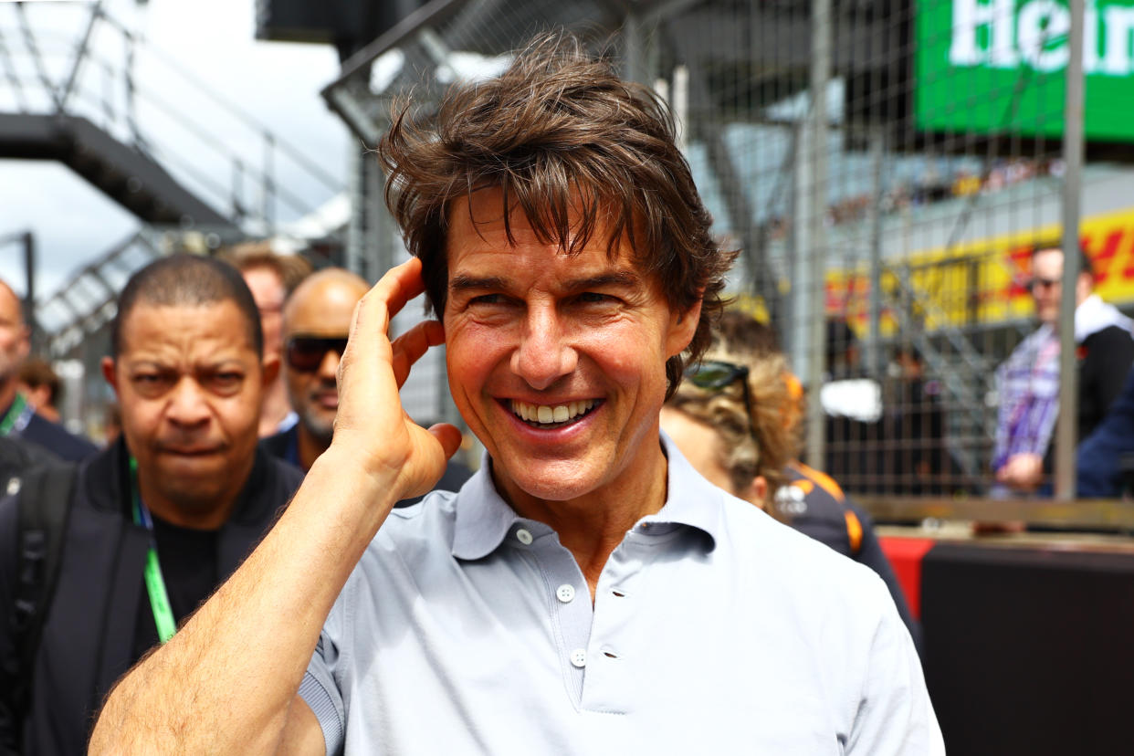 NORTHAMPTON, ENGLAND - JULY 03: Tom Cruise walks in the Paddock prior to the F1 Grand Prix of Great Britain at Silverstone on July 03, 2022 in Northampton, England. (Photo by Mark Thompson/Getty Images)