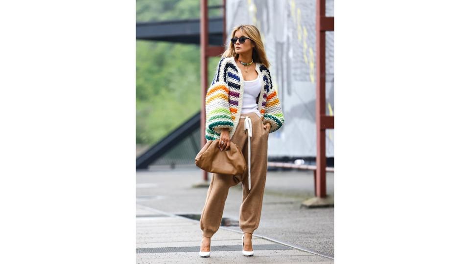 Gitta Banko pairs her slouchy camel coloured joggers with white pumps by Balenciaga