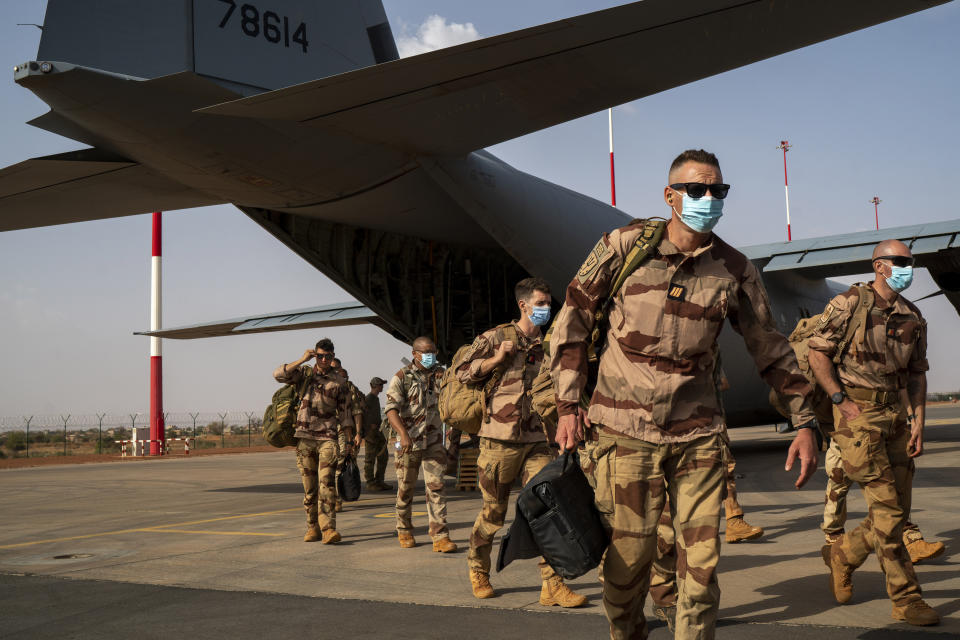 FILE - French soldiers disembark from a U.S. Air Force C130 cargo plane at Niamey, Niger base, on June 9, 2021. On Thursday, Aug. 3, 2023, night, the junta said on state television it was terminating the military agreements and protocols signed with it's former colonial ruler, France. (AP Photo/Jerome Delay, File)