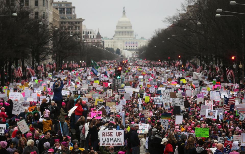 Protesters walk during the Women's March on Washington, with the U.S. Capitol in the background, on January 21, 2017 in Washington DC Mario Tama/Getty Images