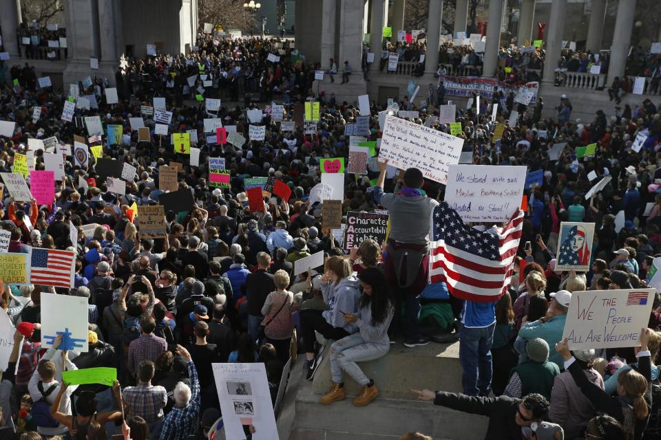 Thousands gather at Denver's City Center Park for a rally in support of the Muslim community and to protest President Donald Trump's executive order to temporarily ban some refugees from seven mostly Muslim countries, in Denver, Saturday, Feb. 4, 2017. (AP Photo/Brennan Linsley)