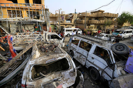 Wreckages of destroyed vehicles are seen at the site of an explosion in Baghdad's Sadr City district, Iraq June 7, 2018. REUTERS/Thaier Al-Sudani