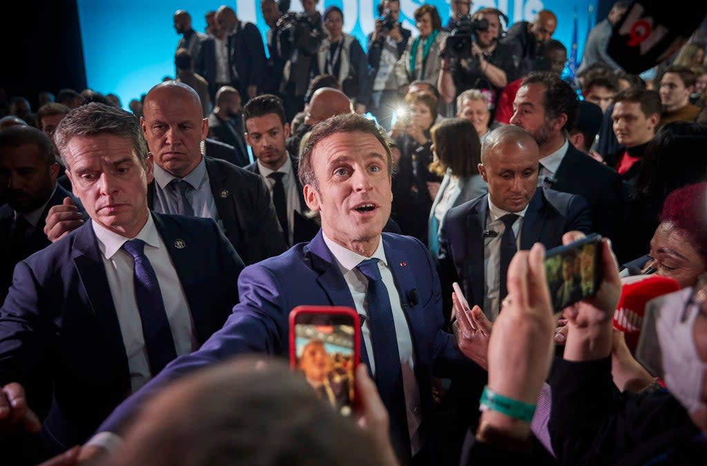 Emmanuel Macron acknowledges his supporters at a rally in Paris after polls closed  (Getty Images)