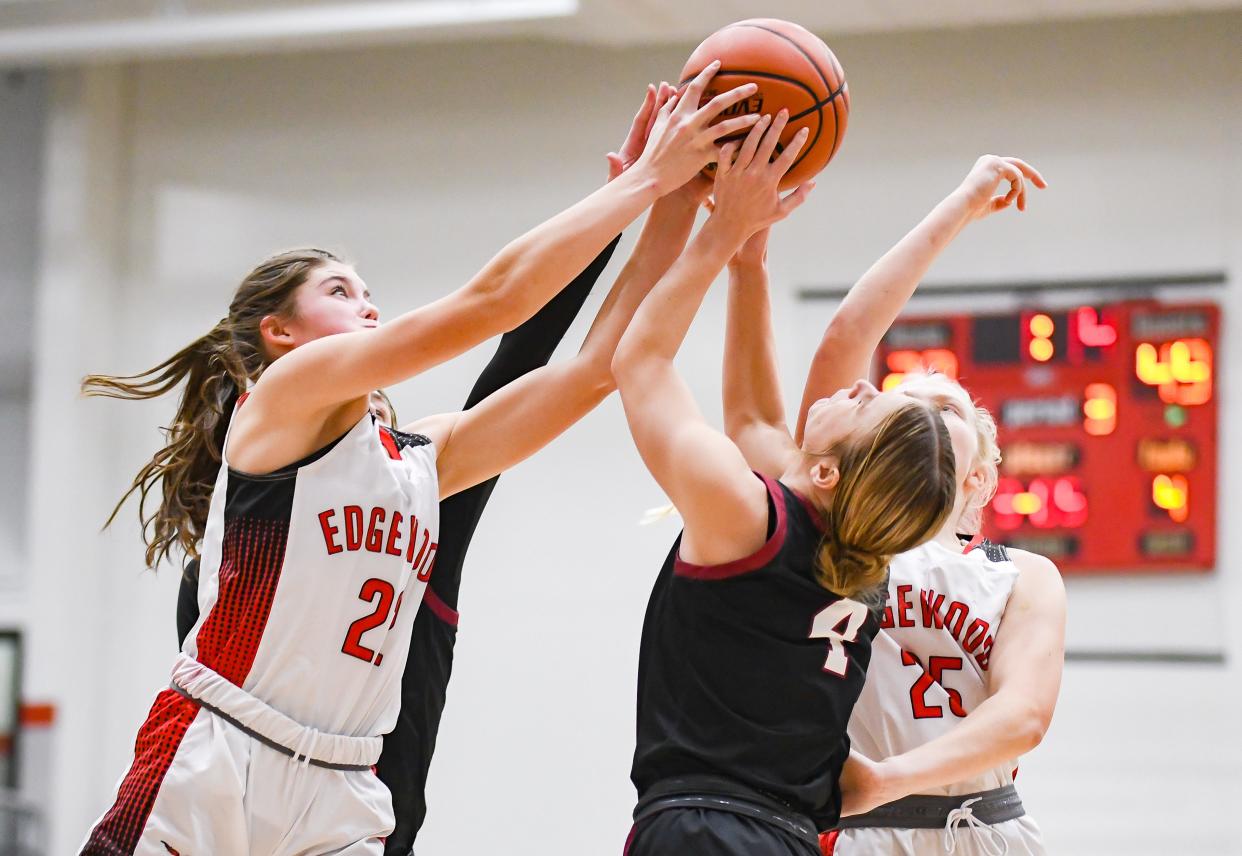 Edgewood’s Macey Crider (22) and Northview’s Brenna Stallcop (4) battle for a rebound during the game at Edgewood on Wednesday, Jan. 3, 2024.