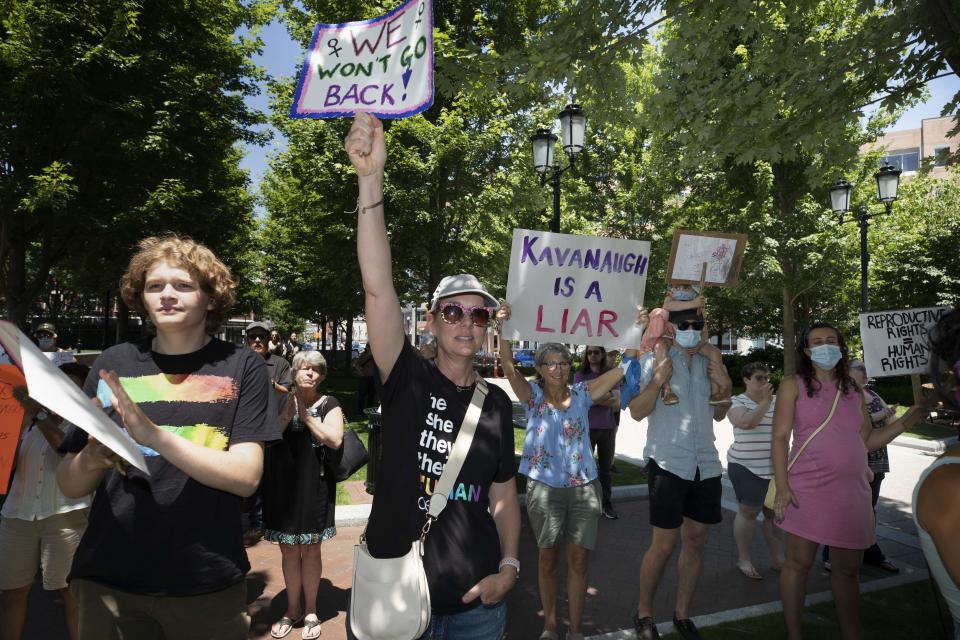 Abortion-rights supporters rally, Saturday, June 25, 2022, in Quincy, Mass., a day after the Supreme Court ended constitutional protections for abortion that had been in place nearly 50 years in a decision by its conservative majority to overturn Roe v. Wade. (AP Photo/Michael Dwyer)