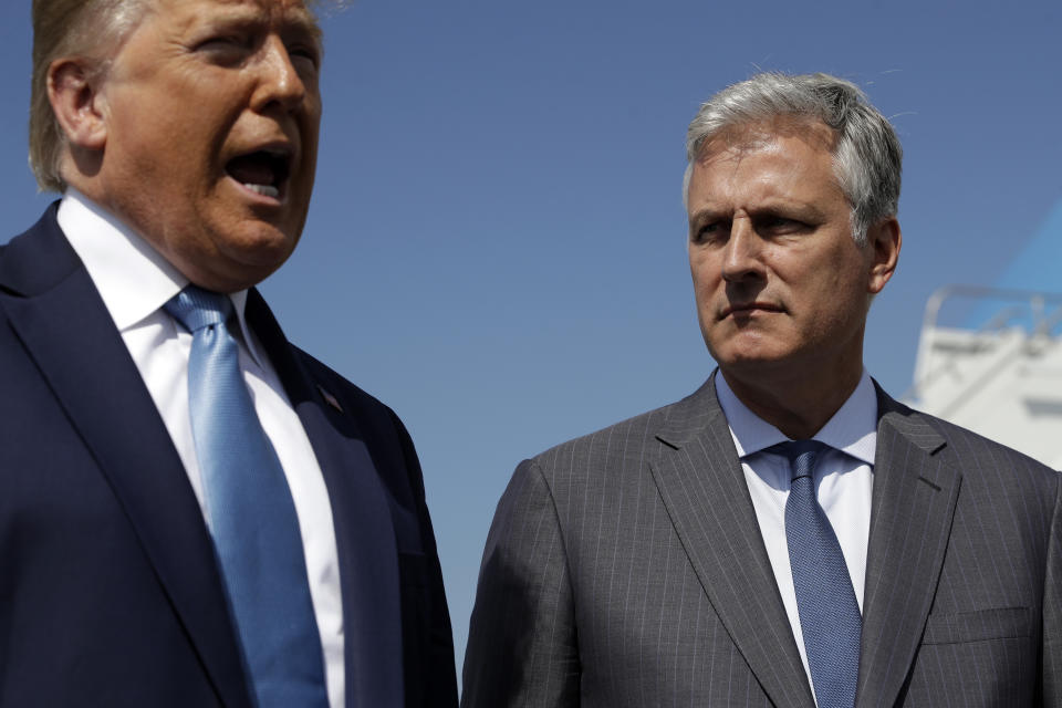 President Donald Trump speaks as Robert O'Brien, just named as the new national security adviser, listens at Los Angeles International Airport, Wednesday, Sept. 18, 2019, in Los Angeles. (AP Photo/Evan Vucci)