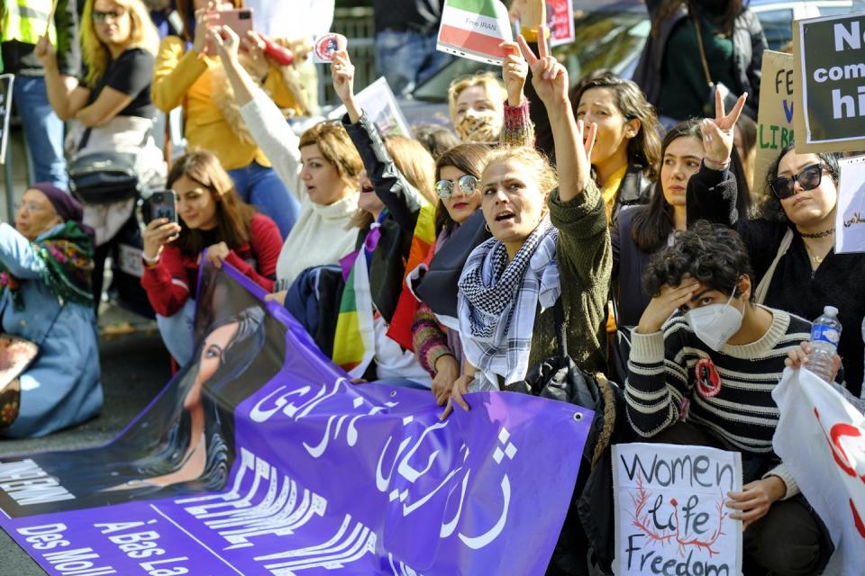 People participate in a demonstration in Brussels, Belgium, against the death of Iranian Mahsa Amini. <a href="https://www.gettyimages.com/detail/news-photo/roxanne-tahbaz-holds-placards-outside-the-foreign-news-photo/1391200084?adppopup=true" rel="nofollow noopener" target="_blank" data-ylk="slk:Thierry Monasse/Getty Images;elm:context_link;itc:0" class="link ">Thierry Monasse/Getty Images</a>