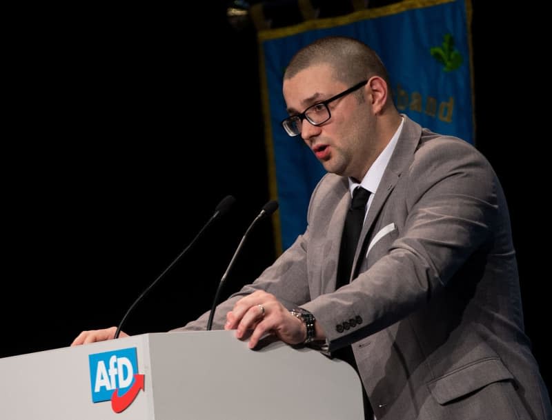 Andreas Jurca, candidate for the European elections, speaks at the European Election Meeting of the Alternative for Germany in the Saxony-Arena. The federal leadership of the far-right Alternative for Germany (AfD) party has issued a warning to three of its members in Bavaria's regional parliament for travelling to Russia for the presidential election in March. Monika Skolimowska/dpa-Zentralbild/dpa