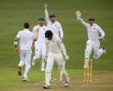 Members of South Africa celebrate the wicket of New Zealand's Martin Guptill during the second day of their first cricket test match in Durban, South Africa, August 20, 2016. REUTERS/Rogan Ward