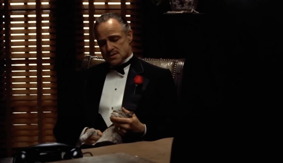 Vito Corleone stroking a cat in The Godfather