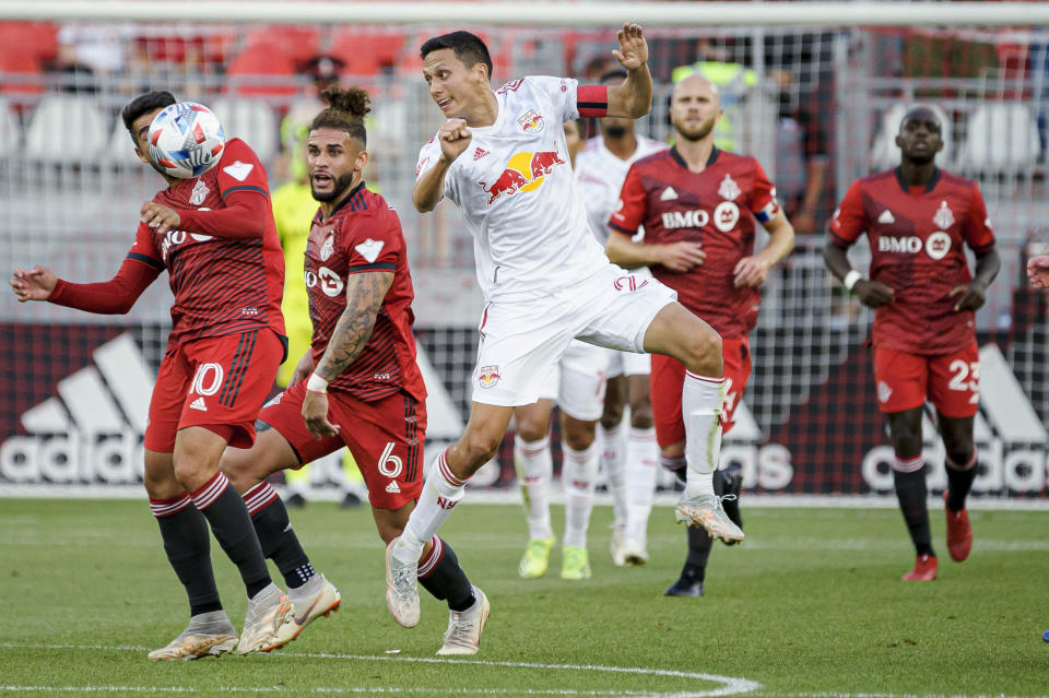 New York Red Bulls midfielder Sean Davis (27) heads the ball during the first half of an MLS soccer match against Toronto FC on Wednesday, July 21, 2021, in Toronto. (Chris Katsarov/The Canadian Press via AP)