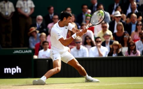 Novak Djokovic of Serbia plays a backhand in his Men's Singles final against Roger Federer of Switzerland during Day thirteen of The Championships - Wimbledon - Credit: GETTY IMAGES