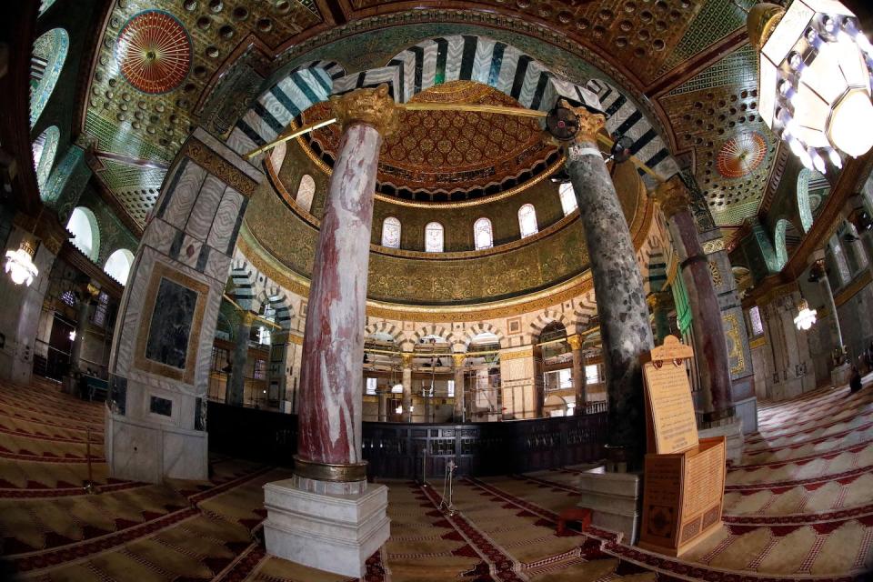 The decorated interior of the golden dome inside the Dome of the Rock mosque at the Al-Aqsa mosque compound, in Jerusalem’s Old City. <a href="https://www.gettyimages.com/detail/news-photo/picture-taken-with-a-fisheye-lens-on-january-10-shows-the-news-photo/903284924?adppopup=true" rel="nofollow noopener" target="_blank" data-ylk="slk:Thomas Coex/AFP via Getty Images;elm:context_link;itc:0;sec:content-canvas" class="link ">Thomas Coex/AFP via Getty Images</a>