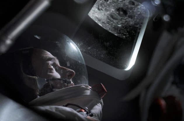 Apollo 11 astronaut Michael Collins (played by Patrick Kennedy) looks out at the moon in a dramatization that’s part of “8 Days: To the Moon and Back.” (BBC Studios)