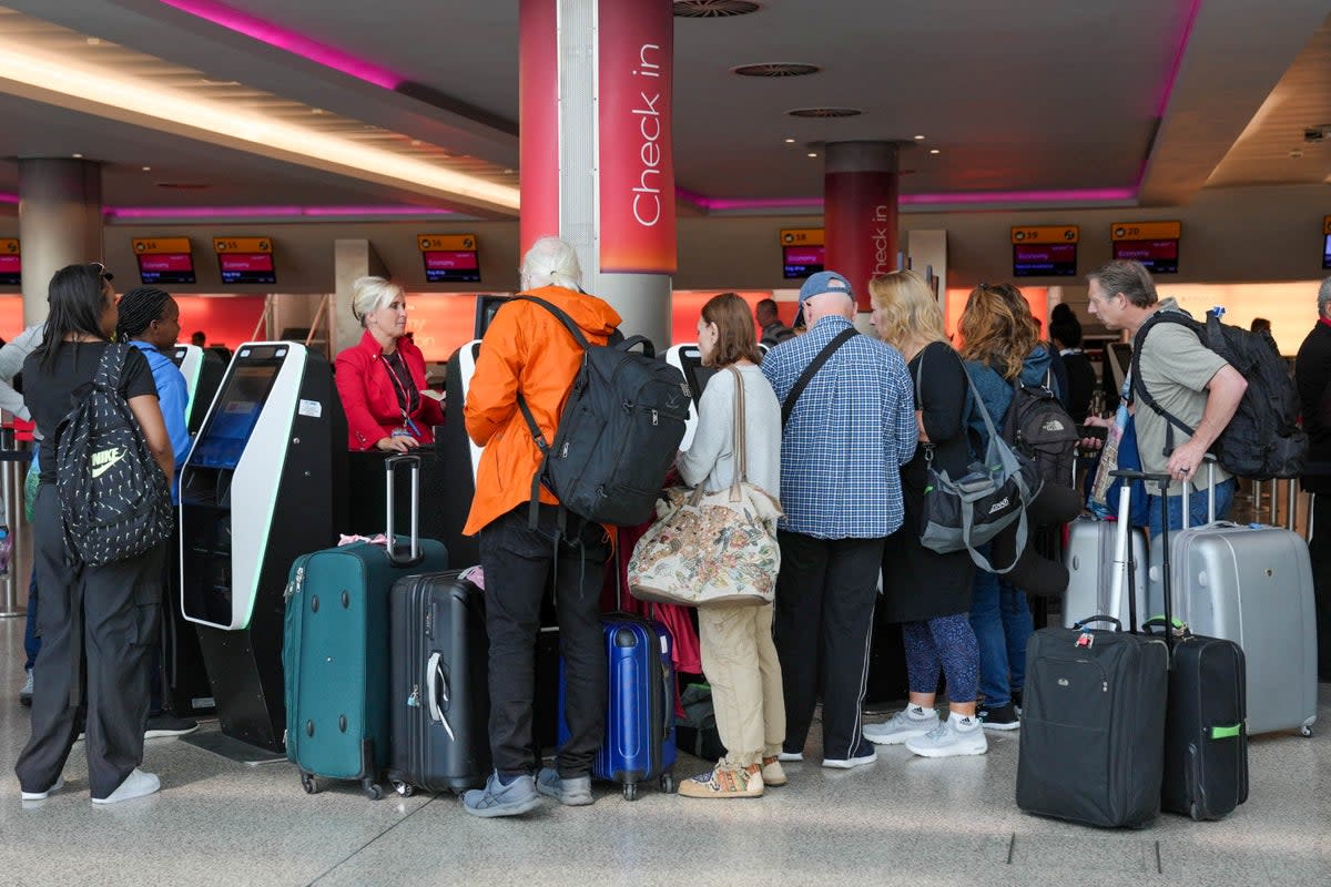 Passengers at Heathrow airport  (REUTERS)