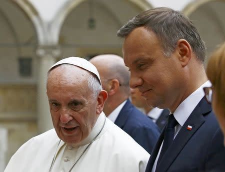 Pope Francis speaks at a welcoming ceremony with Polish President Andrzej Duda (R) at Wawel Royal Castle in Krakow, Poland July 27, 2016. REUTERS/Kacper Pempel