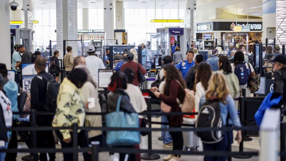 PHOTO: Departing travelers wait at a Transportation Security Administration (TSA) security checkpoint at Baltimore-Washington Airport (BWI) in Baltimore, Maryland, April 26, 2023. (Ting Shen/Bloomberg via Getty Images)