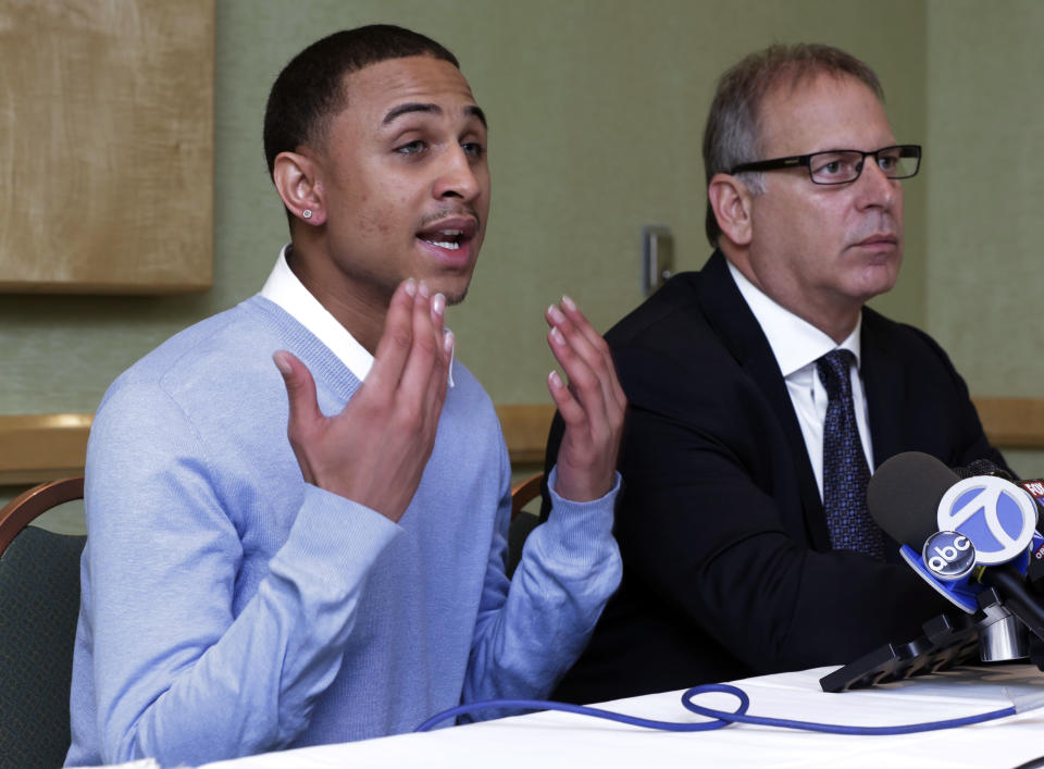 Sheldon Stephens, left, accompanied by his attorney Jeff Herman, addresses a news conference, in New York, Tuesday, March 19, 2013. Stephens, 24, of Harrisburg, Pa., has filed suit against Kevin Clash, former voice of the "Sesame Street" character Elmo, claiming the entertainer lured him into drug-fueled sex when he was 16. (AP Photo/Richard Drew)