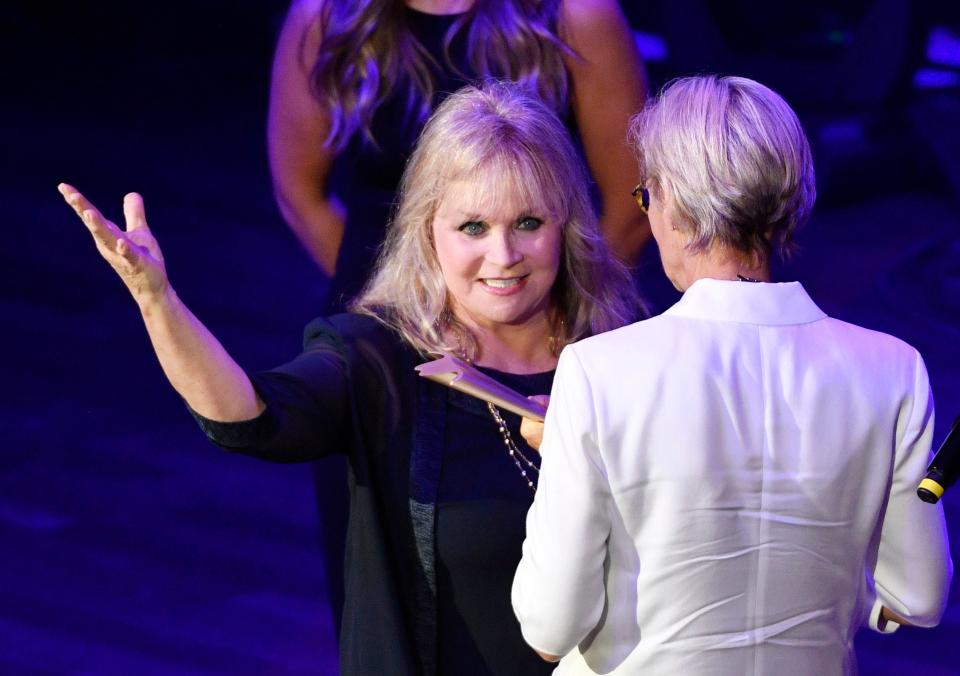 Barbara Mandrell delivers the ACM Poet’s Award to Kye Fleming at the 13th Annual ACM Honors at the Ryman Auditorium in Nashville on Aug. 21.