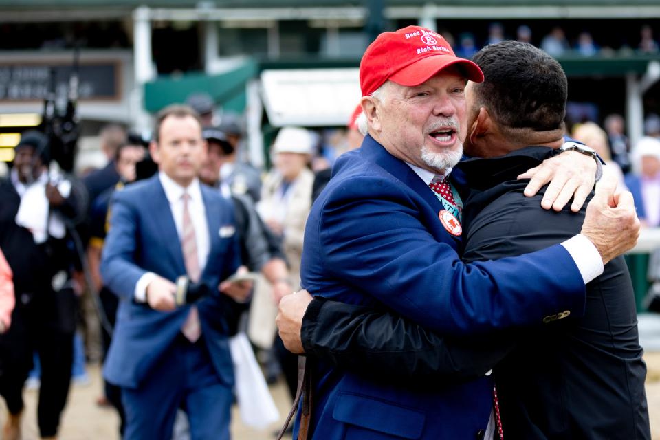 Rich Strike owner Richard Dawson smiles while embracing someone after his horse won the 148th Kentucky Derby at Churchill Downs on Saturday in Louisville, Ky.