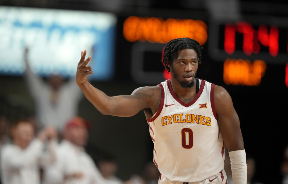 Iowa State forward Tre King (0) reacts after making a 3-point basket against Kansas during the first half of an NCAA college basketball game, Saturday, Jan. 27, 2024, in Ames, Iowa. (AP Photo/Matthew Putney)